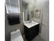 Bright bathroom featuring a modern vanity, mirror, and toilet at 3420 Gerber Daisy Ln, Oviedo, FL 32766