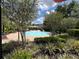 Community circular fountain with lush landscaping and seating areas for relaxation at 3420 Gerber Daisy Ln, Oviedo, FL 32766
