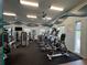 Brightly lit exercise room with workout equipment, and soothing wall art for a great workout experience at 3420 Gerber Daisy Ln, Oviedo, FL 32766