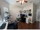 Home office space with an ergonomic chair, computer setup, and a cat tree at 3420 Gerber Daisy Ln, Oviedo, FL 32766