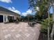 Exterior patio area with many tables and chairs to sit, relax, and enjoy the community at 3420 Gerber Daisy Ln, Oviedo, FL 32766