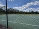 Community pickleball court with a net and fenced-in area, providing residents with an active recreational space at 3420 Gerber Daisy Ln, Oviedo, FL 32766