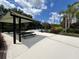 Inviting community picnic area with shaded seating, lush landscaping, and a decorative fountain for relaxation at 3420 Gerber Daisy Ln, Oviedo, FL 32766