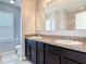 Bathroom with double vanity, a large mirror, and a separate shower/toilet area at 3449 Seneca Club Loop # B, Orlando, FL 32808