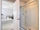 Modern bathroom featuring a glass-enclosed shower with a view into the bedroom at 3449 Seneca Club Loop # B, Orlando, FL 32808