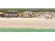 Expansive oceanfront condo building on a pristine beach, surrounded by lush greenery and neighborhood at 4071 S Atlantic Ave # 803, New Smyrna Beach, FL 32169