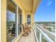 Enjoy the views from the balcony, complete with two chairs, sliding glass doors, and a view of city at 4071 S Atlantic Ave # 803, New Smyrna Beach, FL 32169