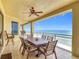 Beautiful ocean views from the balcony's dining table and chairs, perfect for outdoor entertaining at 4071 S Atlantic Ave # 803, New Smyrna Beach, FL 32169