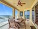 Relax on the tiled balcony featuring a wood dining table, seating six, and overlooking the ocean at 4071 S Atlantic Ave # 803, New Smyrna Beach, FL 32169