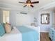Relaxing bedroom with soothing colors, featuring a ceiling fan and natural light at 4071 S Atlantic Ave # 803, New Smyrna Beach, FL 32169