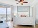 Cozy bedroom with a coastal theme, featuring a large window with beautiful city views at 4071 S Atlantic Ave # 803, New Smyrna Beach, FL 32169