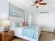 Serene bedroom with a beachy vibe, showcasing a comfortable bed and ample closet space at 4071 S Atlantic Ave # 803, New Smyrna Beach, FL 32169