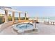 Luxury oceanfront hot tub with comfortable seating and pergola, perfect for relaxation at 4071 S Atlantic Ave # 803, New Smyrna Beach, FL 32169