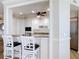 Elegant kitchen showcasing custom cabinetry, granite countertops, and stainless steel appliances with open breakfast bar seating at 4071 S Atlantic Ave # 803, New Smyrna Beach, FL 32169