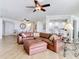 Spacious living room with leather sectional, offering multiple seating options at 4071 S Atlantic Ave # 803, New Smyrna Beach, FL 32169