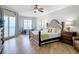 Bright main bedroom boasts ocean views, balcony access, and stylish furnishings at 4071 S Atlantic Ave # 803, New Smyrna Beach, FL 32169