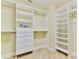 Custom walk-in closet with built-in shelving and drawers, maximizing storage space at 4071 S Atlantic Ave # 803, New Smyrna Beach, FL 32169