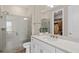 Modern bath with a tiled shower and a white vanity with a quartz counter and ample storage at 4152 Winding Pines Dr, Apopka, FL 32712