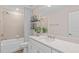 Stylish bathroom with tile walls, a shower-tub combo, and modern vanity at 4152 Winding Pines Dr, Apopka, FL 32712