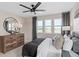 This room features a relaxing bedroom with large windows that bring in ample natural light at 4152 Winding Pines Dr, Apopka, FL 32712