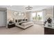Inviting bedroom featuring a queen bed with neutral bedding, and natural light from large windows at 4152 Winding Pines Dr, Apopka, FL 32712
