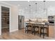 Spacious kitchen with white cabinetry, stainless appliances, and an adjacent pantry at 4152 Winding Pines Dr, Apopka, FL 32712