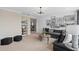Relaxing living room with a comfortable sofa, modern decor, and stylish shelving with accents at 4152 Winding Pines Dr, Apopka, FL 32712
