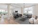 Bright and airy living room with modern furnishings, hardwood floors, recessed lighting, and large windows at 4152 Winding Pines Dr, Apopka, FL 32712