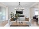 Stunning living room features a sleek entertainment center and plenty of comfortable seating at 4152 Winding Pines Dr, Apopka, FL 32712