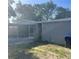 Cozy home with a screened-in porch and a modest, fenced backyard at 435 N Observatory Dr, Orlando, FL 32835