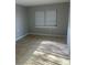 Bright bedroom featuring tile floors, fresh paint and a window at 435 N Observatory Dr, Orlando, FL 32835