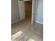 Cozy bedroom featuring tile flooring and fresh paint at 435 N Observatory Dr, Orlando, FL 32835