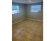 Bedroom with natural light, two windows and tile flooring at 435 N Observatory Dr, Orlando, FL 32835