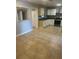 The kitchen boasts ample counter space, white cabinetry, and tile flooring that extends into the adjacent dining area at 435 N Observatory Dr, Orlando, FL 32835