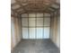Inside a storage shed with a wooden frame with white siding, offering ample storage space at 435 N Observatory Dr, Orlando, FL 32835