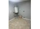 A utility room with tile flooring and a water heater at 435 N Observatory Dr, Orlando, FL 32835