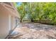 Backyard of home featuring ample space and mature trees at 4748 Amoy Ct, Orlando, FL 32811