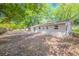 Backyard with plentiful space featuring mature trees and privacy fence at 4748 Amoy Ct, Orlando, FL 32811