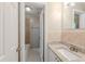 Bright bathroom featuring granite countertops, modern fixtures, and tile flooring at 4748 Amoy Ct, Orlando, FL 32811