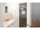 Bathroom vanity with granite countertops, modern fixtures, and a view of the bedroom at 4748 Amoy Ct, Orlando, FL 32811