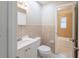 Bathroom with neutral tile, vanity, toilet, and shower/tub combo at 4748 Amoy Ct, Orlando, FL 32811
