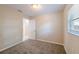 Bedroom with neutral carpet, paint, and window at 4748 Amoy Ct, Orlando, FL 32811