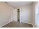 Bedroom featuring carpet, a closet, and a bright window view at 4748 Amoy Ct, Orlando, FL 32811