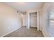 Bedroom featuring carpet, a closet, and a hallway view at 4748 Amoy Ct, Orlando, FL 32811