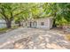 Charming single-story home with a spacious front yard and inviting curb appeal enhanced by mature trees at 4748 Amoy Ct, Orlando, FL 32811