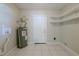 Laundry room with shelving and tile flooring at 4748 Amoy Ct, Orlando, FL 32811