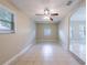 Spacious living room with neutral paint, tile floors, and ceiling fan at 4748 Amoy Ct, Orlando, FL 32811
