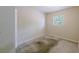 This bedroom features a small window and carpet floors at 4805 Okeefe St, Orlando, FL 32808