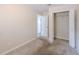 This bedroom offers a carpet floor and a large closet at 4805 Okeefe St, Orlando, FL 32808