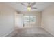 A bedroom showing carpet floors, a window with blinds, and a ceiling fan at 4805 Okeefe St, Orlando, FL 32808